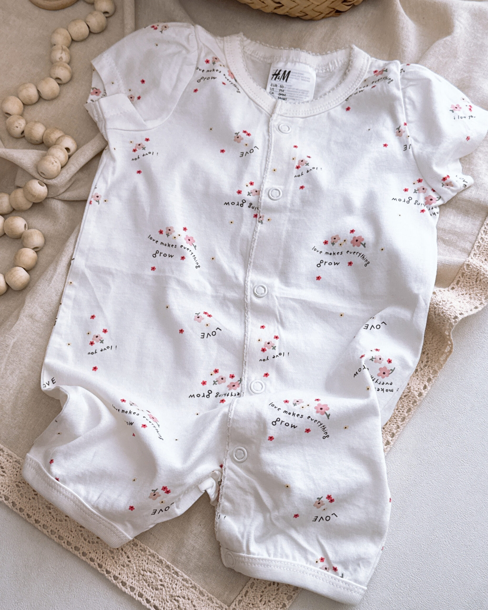 رامپر نوزادی برند H&M مدل سفید گل love